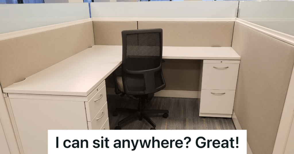 empty cubicle with desk and chair