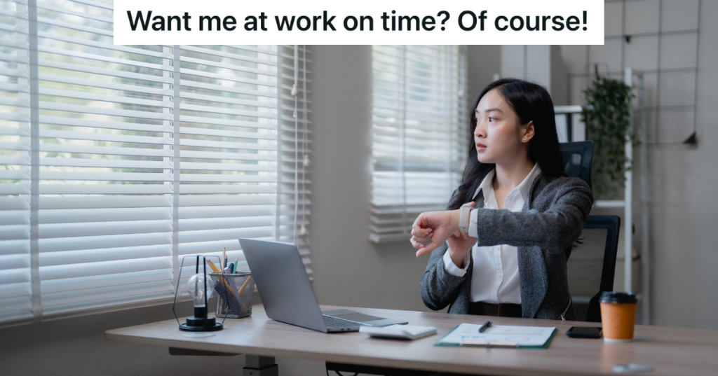 woman at work looking at her watch and out the window