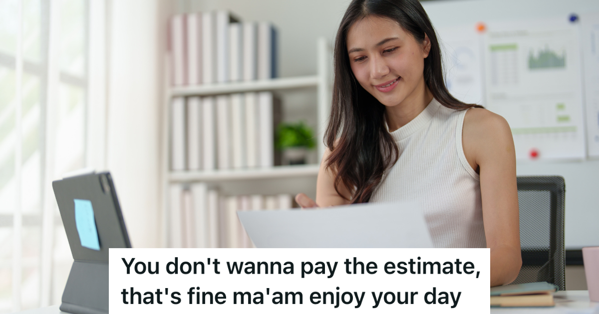 business woman looking at computer and paperwork