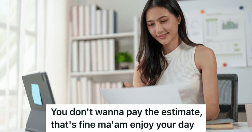 business woman looking at computer and paperwork