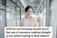 Coworker Doesn’t Notice A Big Guy Walking Down The Hallway, So She Walks Right Into Him And Drops Her Phone