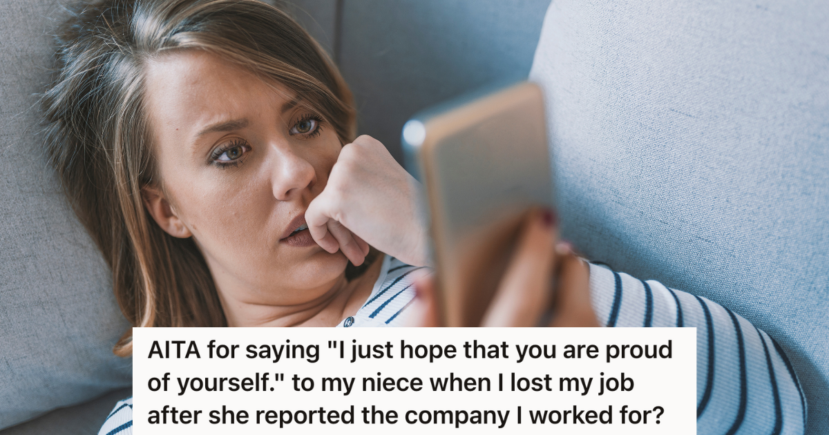 sad woman lying down on couch looking at phone