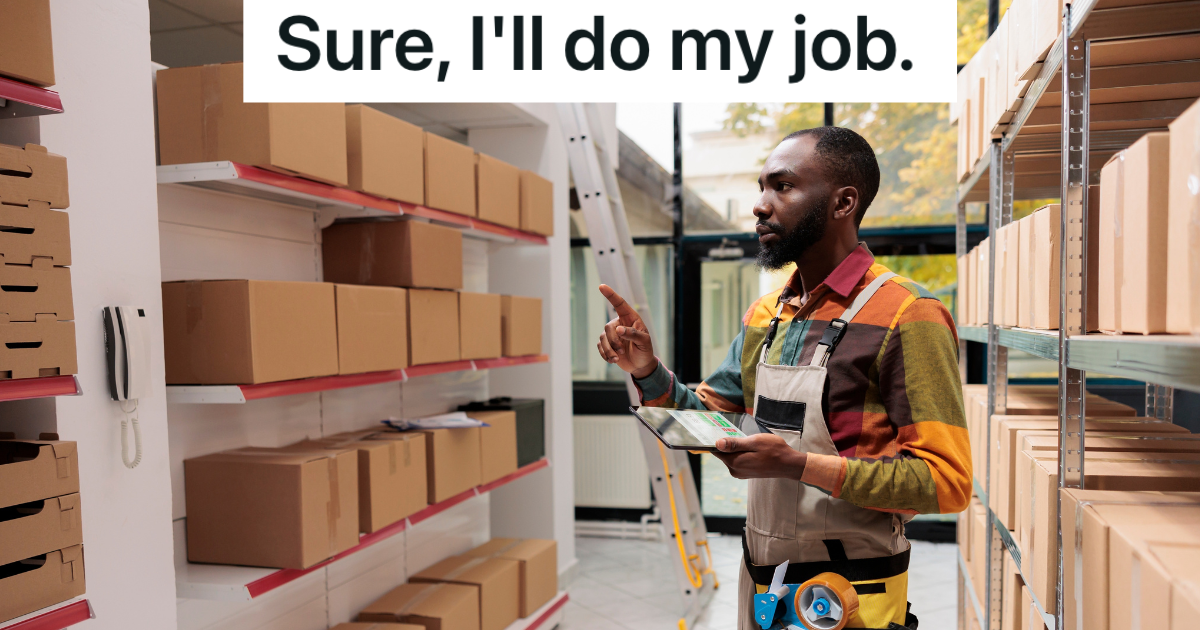 stockroom employee looking at shelves of boxes