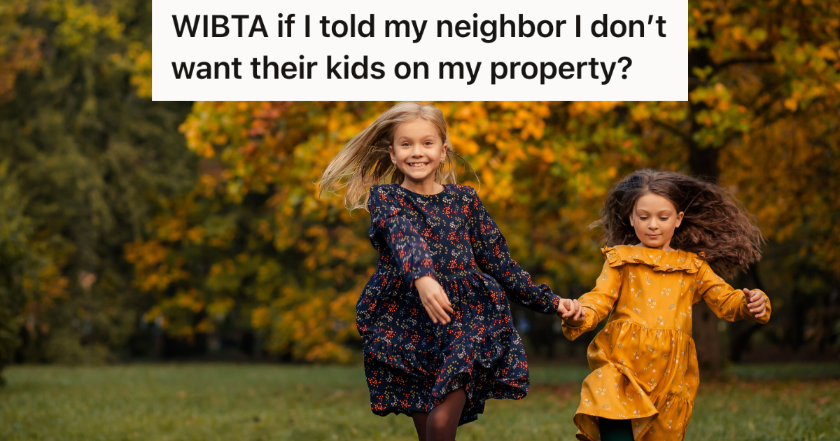 two little girls running in the grass on a fall day
