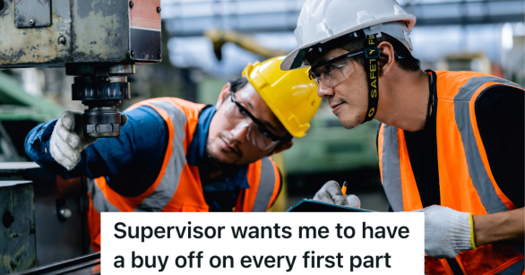 two men in hardhats looking at a machine
