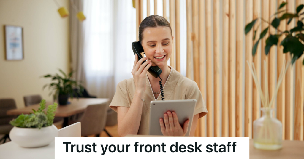 woman on the phone at the front desk at a spa