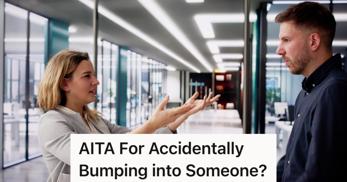 male and female coworkers talking in hallway