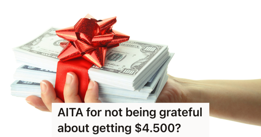 red ribbon and bow around stack of cash