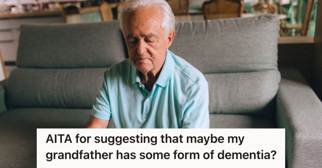 Old man looking intently at his phone