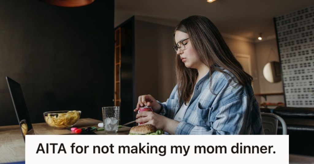 Young woman eating her meal in front of her laptop