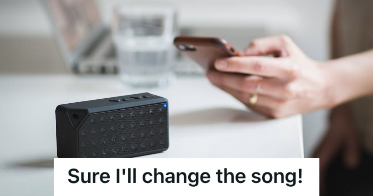 Woman playing music using her phone connected to a speaker