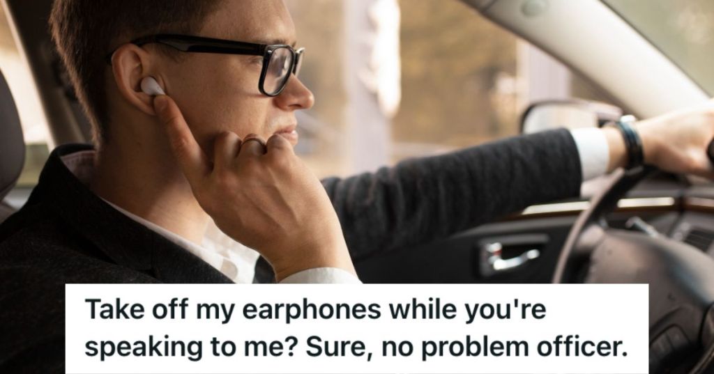 Man driving with an earphone