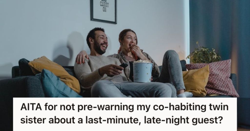 Man and woman watching a movie while eating popcorn