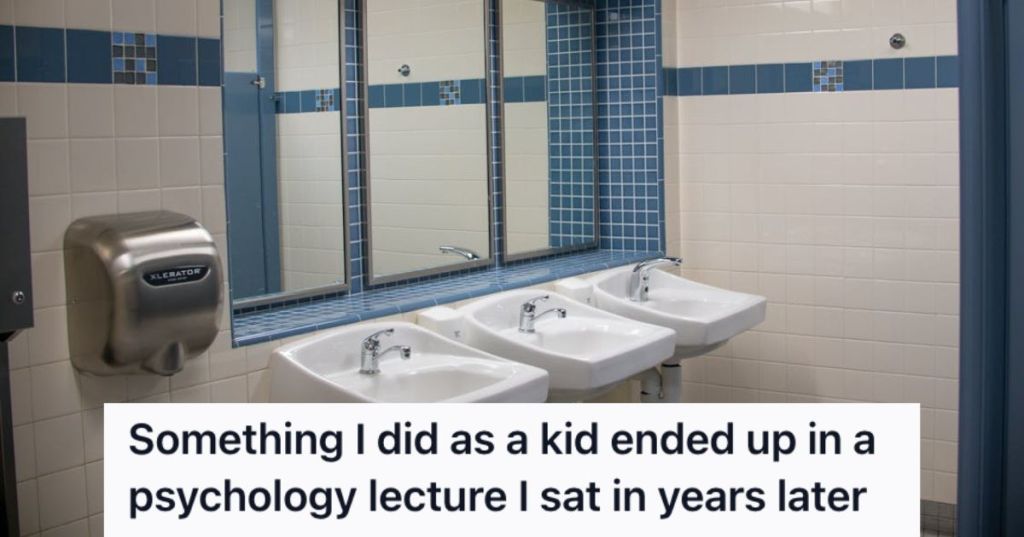 An empt7y public restroom with faucets, mirror, and hand dryer