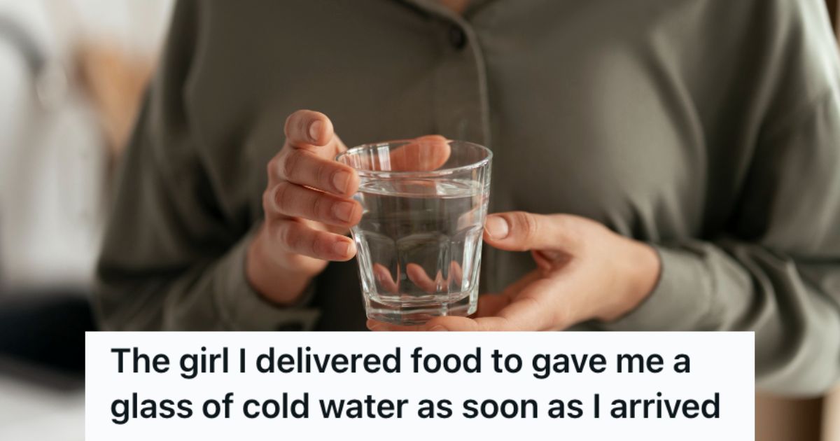 Woman holding a glass of water