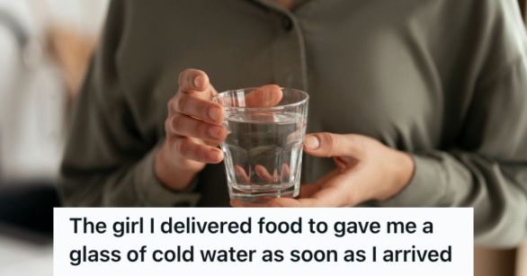 Woman holding a glass of water