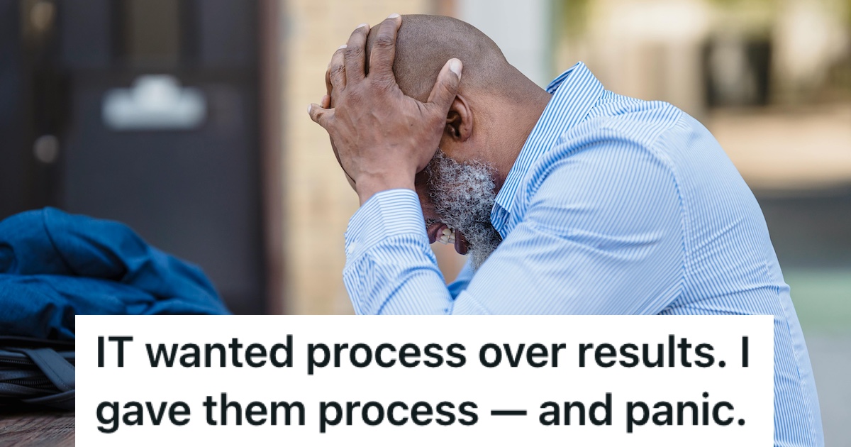 A man in a shirt with his head in his hands