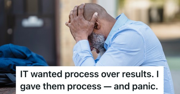 A man in a shirt with his head in his hands