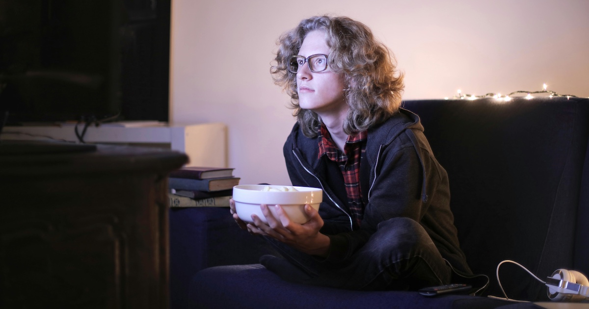 Watching TV on the sofa with popcorn