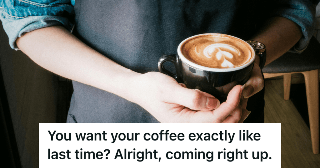 barista holding a mug of coffee