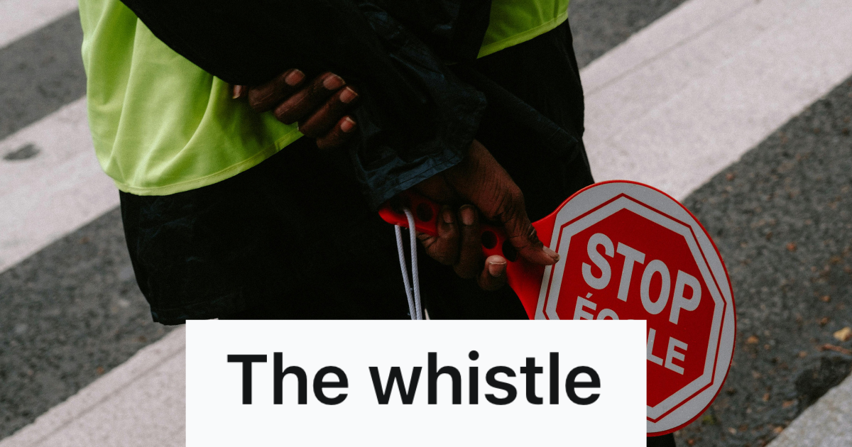 crossing guard holding a stop sign