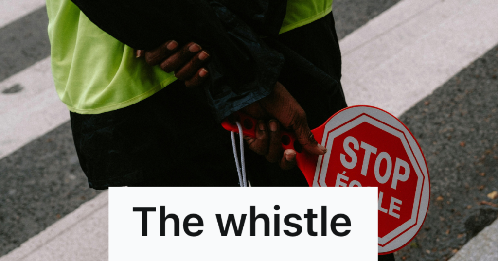 crossing guard holding a stop sign