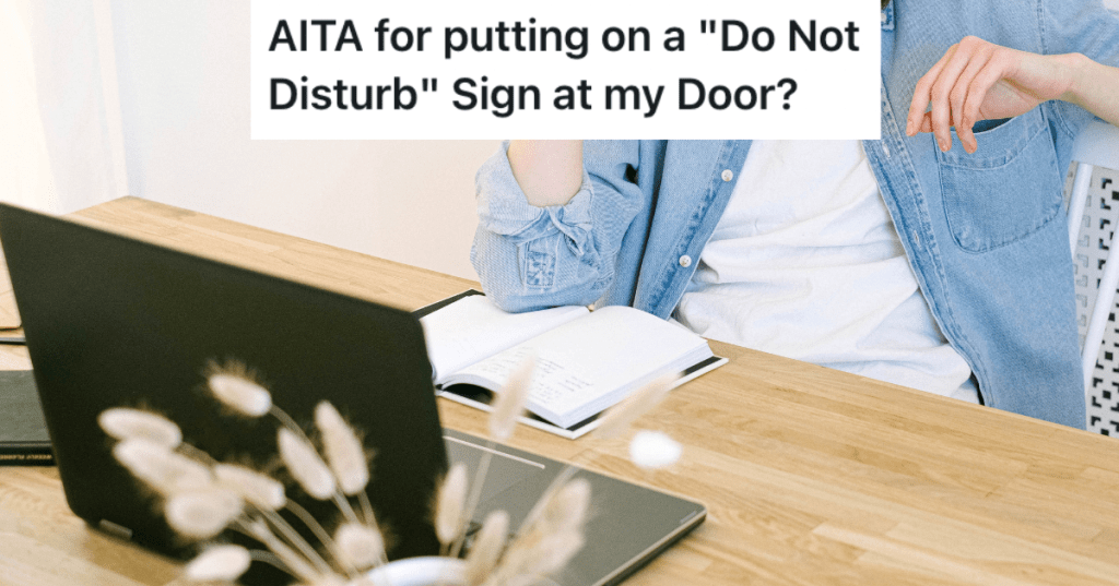 Woman sitting at table with notebook and laptop.