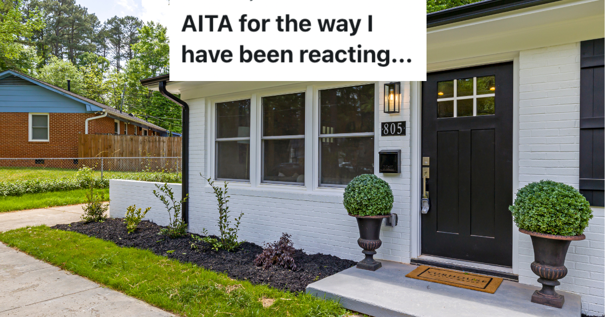Front door of a house with shrubs.