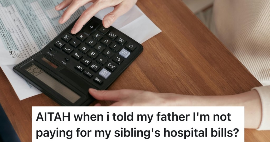 person using calculator to add up bills