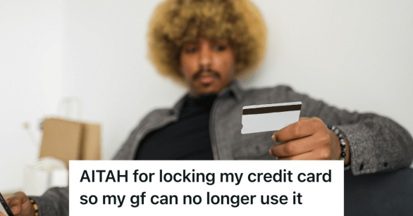 man holding his credit card