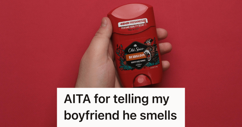 man holding up deodorant container