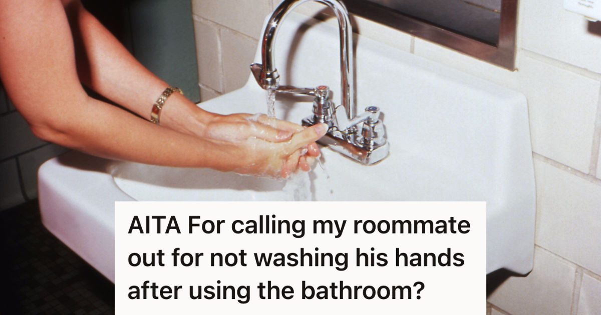 person washing their hands at the sink