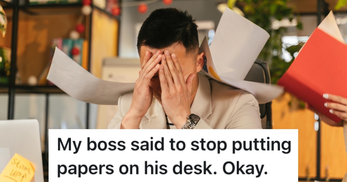 stressed out man with paperwork behind him