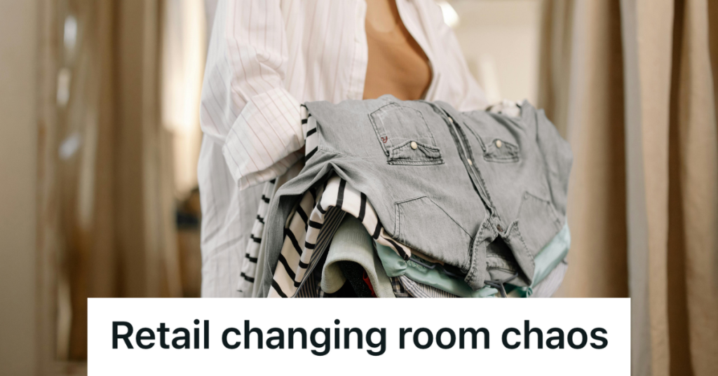 retail employee holding stack of clothes by the fitting room