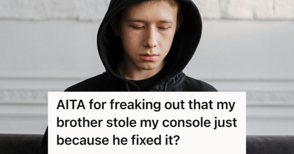 sad teen boy in black hoodie looking down