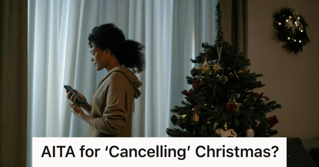 upset woman on her phone by the christmas tree