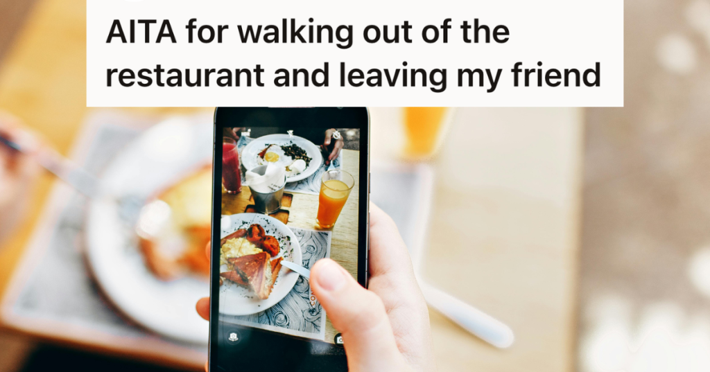 woman taking a picture of her food