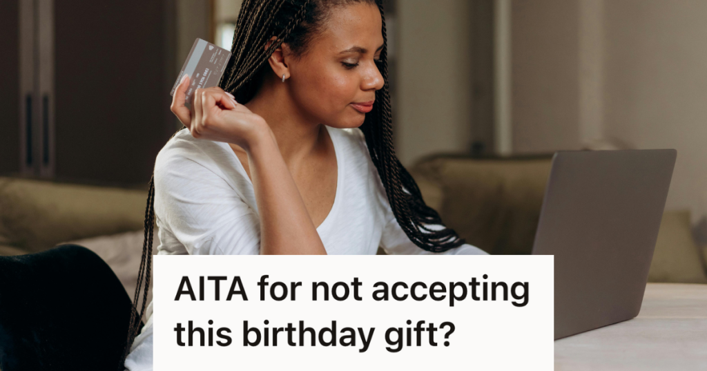 woman using a credit card at her computer