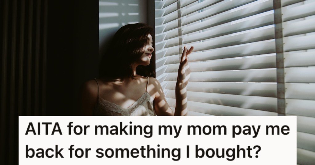 A woman looking out of bedroom blinds