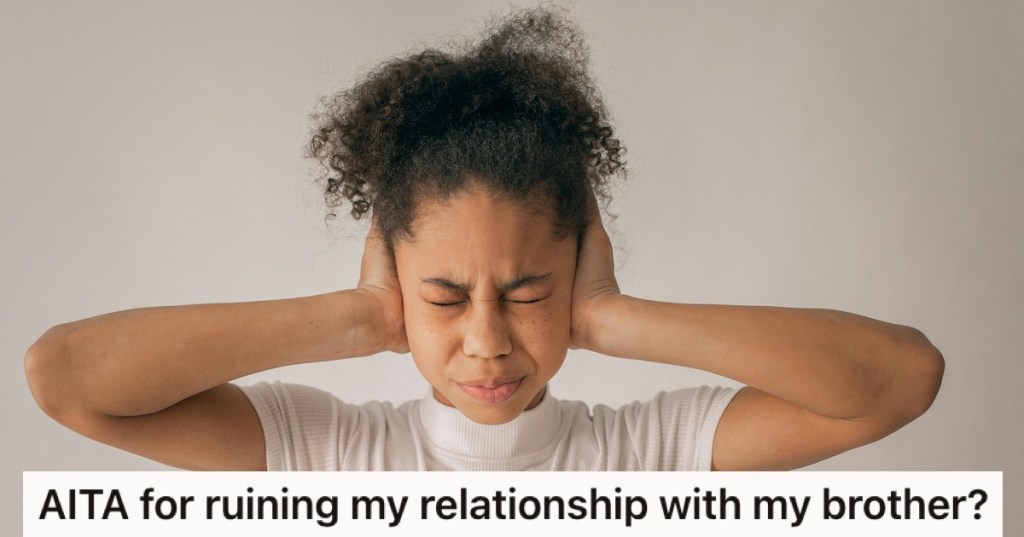 A teen with her hands over her ears