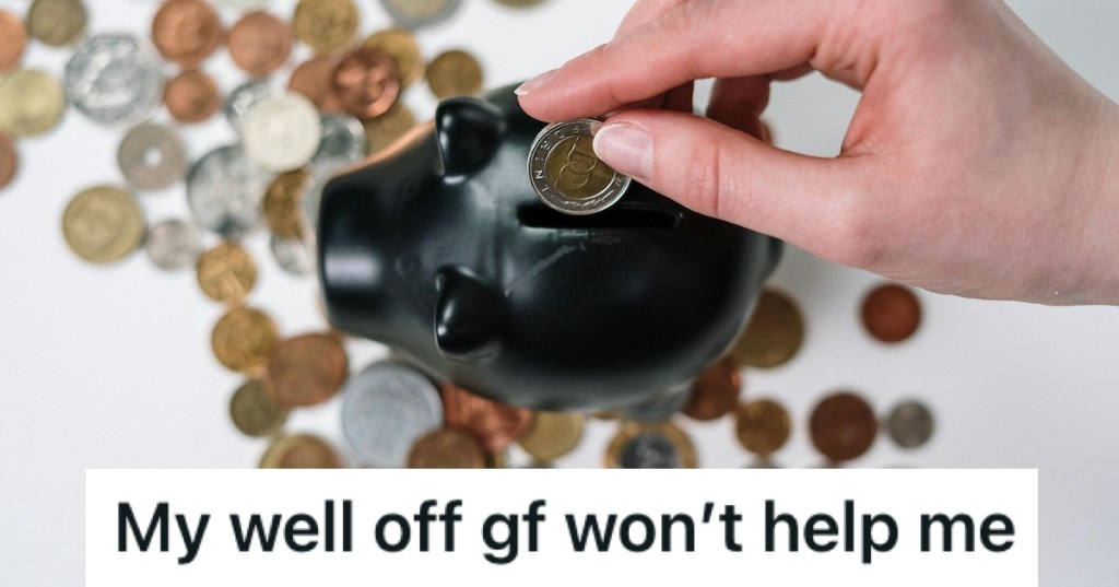 Putting coins into a black piggybank