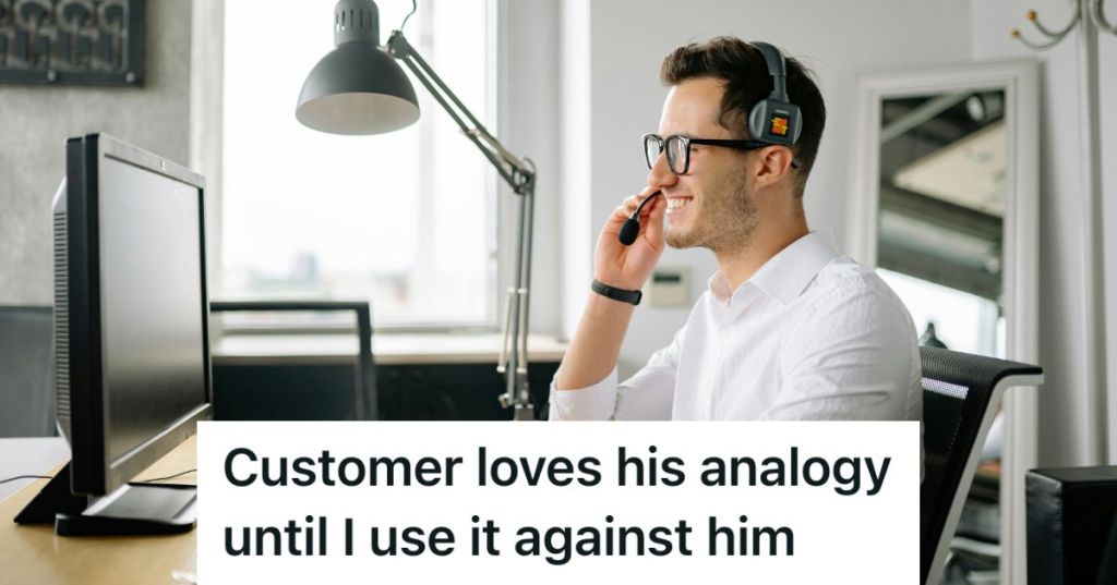 Man in an office wearing a headset looking at his laptop