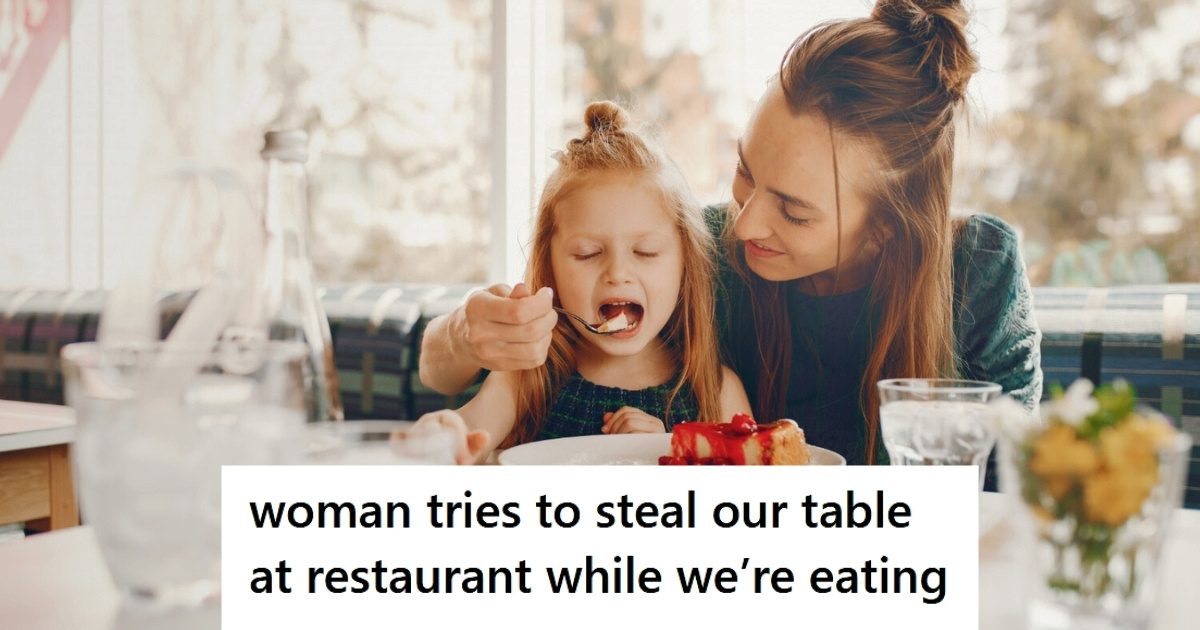 Mom helping daughter eat at restaurant