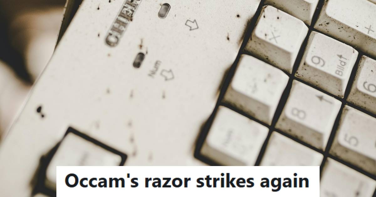 Dirty keyboard that's covered with crumbs food or pencil shavings