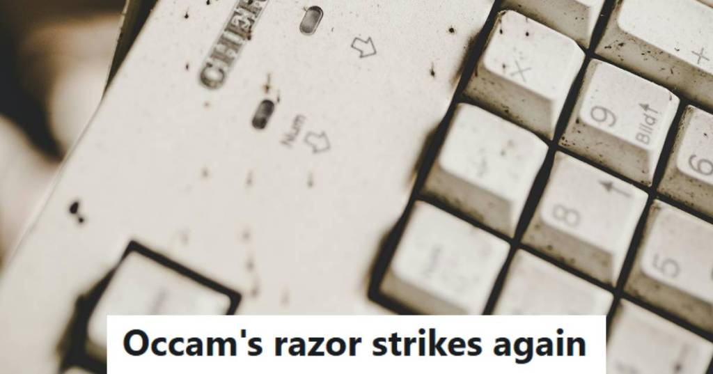 Dirty keyboard that's covered with crumbs food or pencil shavings