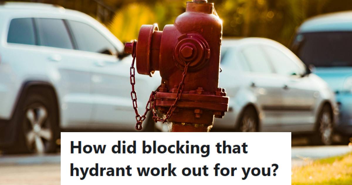 Fire hydrant placed on the side of a residential street with cars in the background