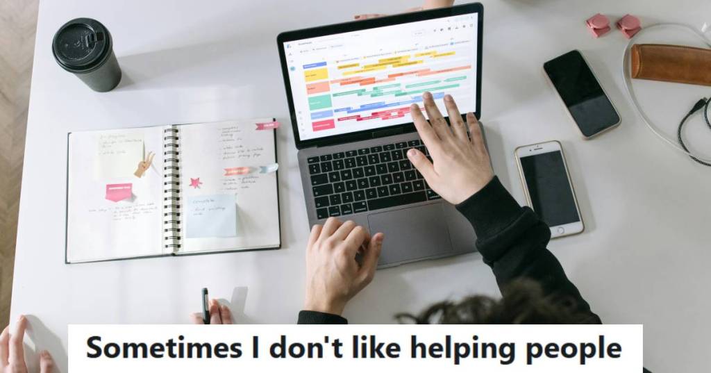 IT employee trying to help a colleague fix his slow laptop