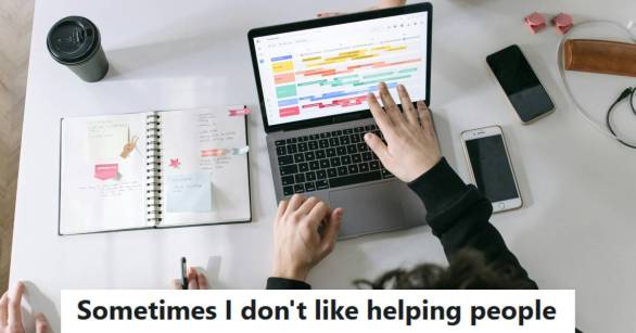 IT employee trying to help a colleague fix his slow laptop