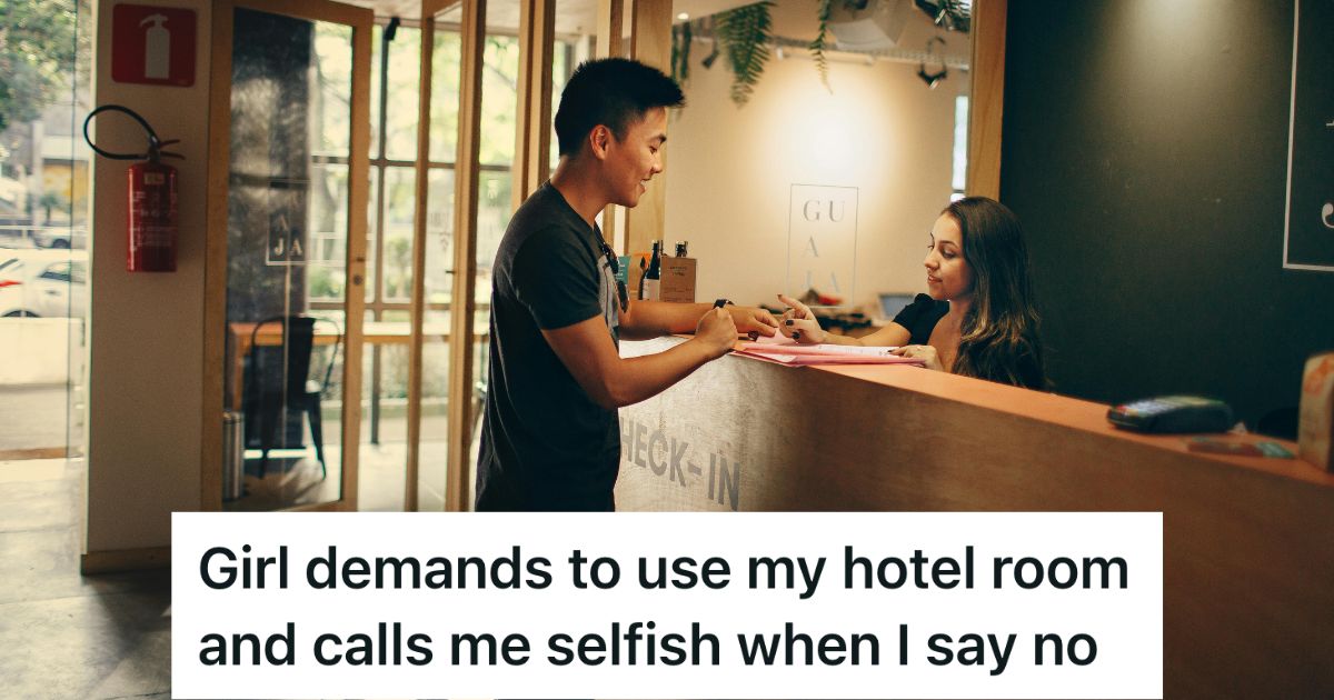 Man talking to a receptionist at a hotel front desk
