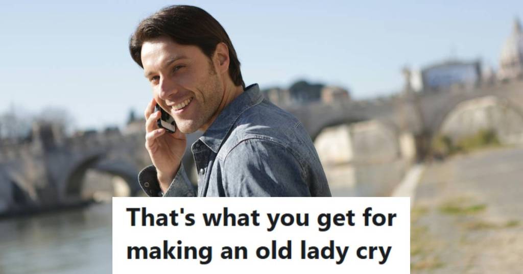Man smiling and holding his phone as he calls into work